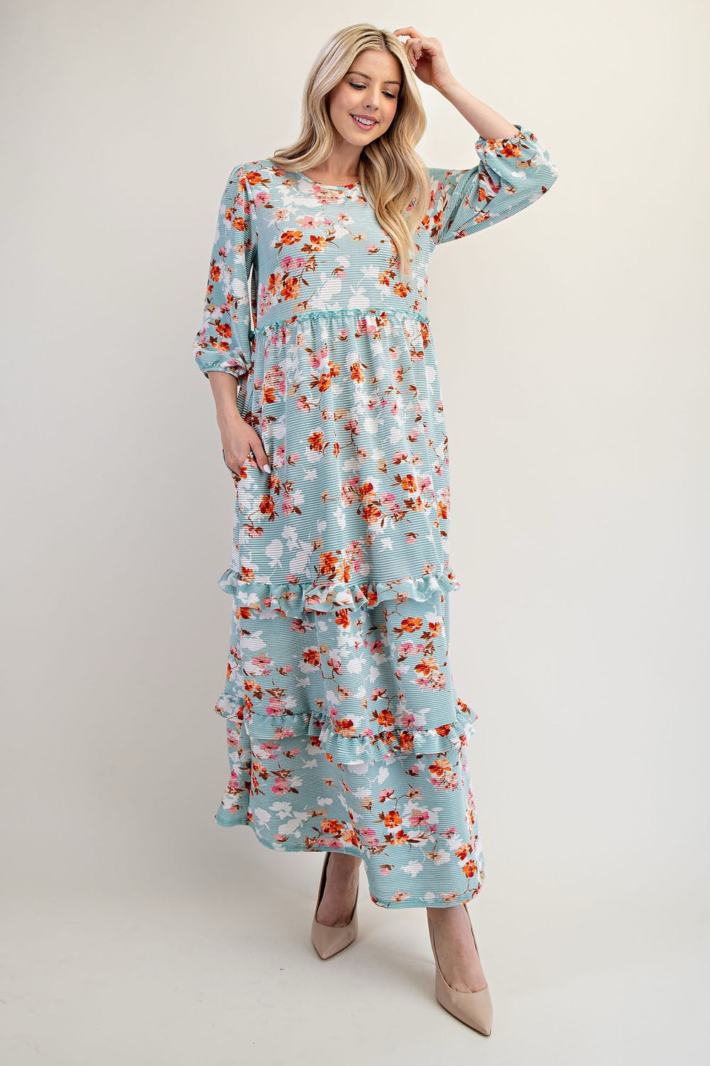 Light teal Celeste Clothing modest floral tiered maxi dress with long sleeves and flowing silhouette, perfect for elegant summer wear.