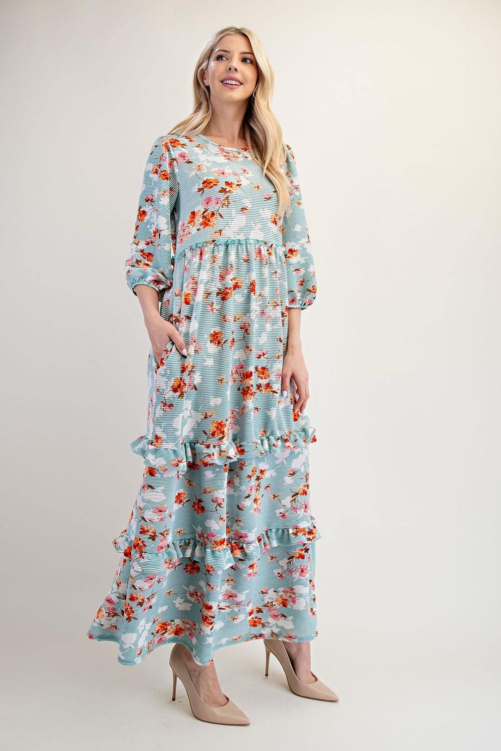 Modest floral tiered maxi dress by Celeste Clothing in sage light teal, flowing dress with tiered layers and floral pattern.