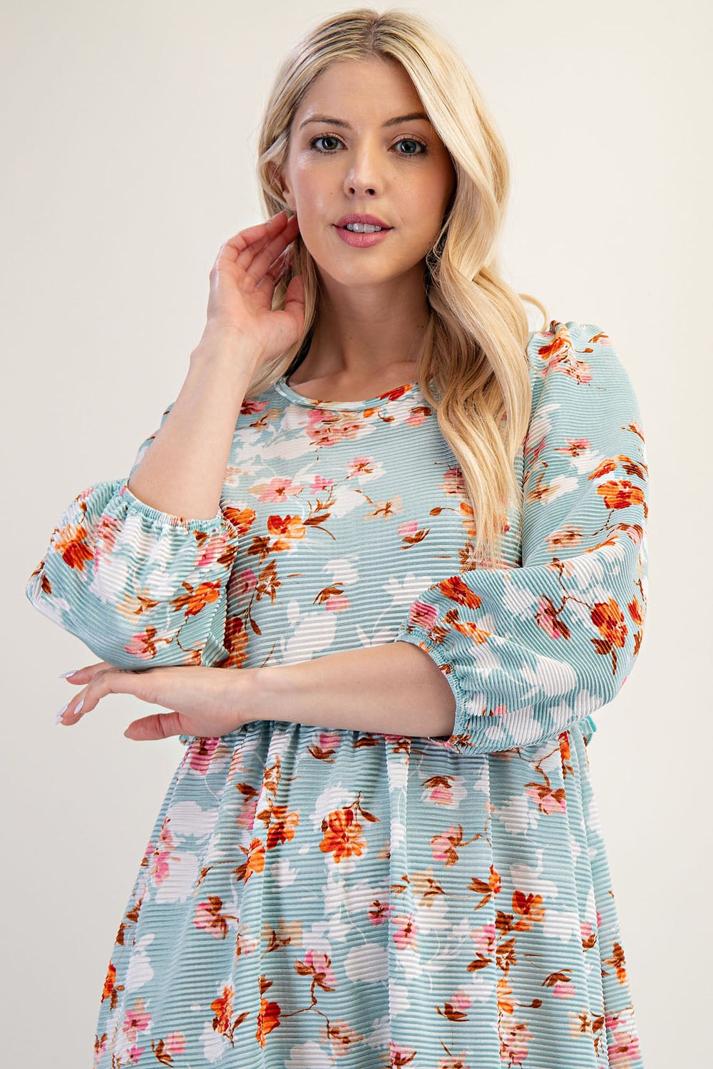 Modest floral tiered maxi dress in sage green from Celeste Clothing, featuring light teal colors and flowing fabric.