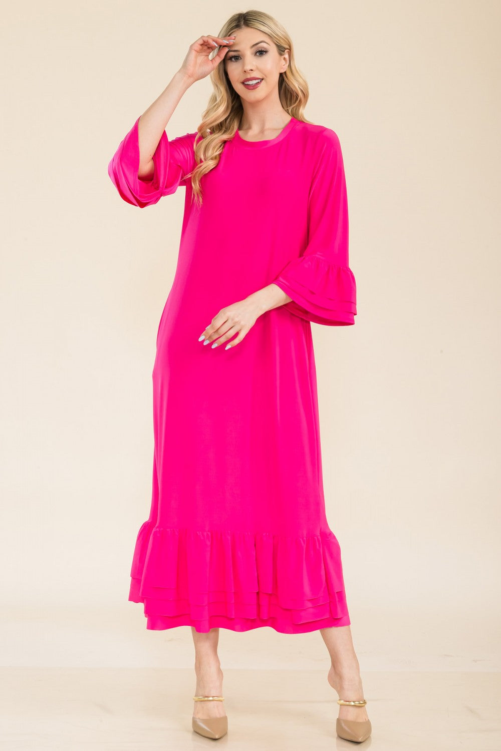 Pink modest 3/4 sleeve dress with ruffle bell sleeves from Celeste Clothing, featuring a flattering fit and elegant design.