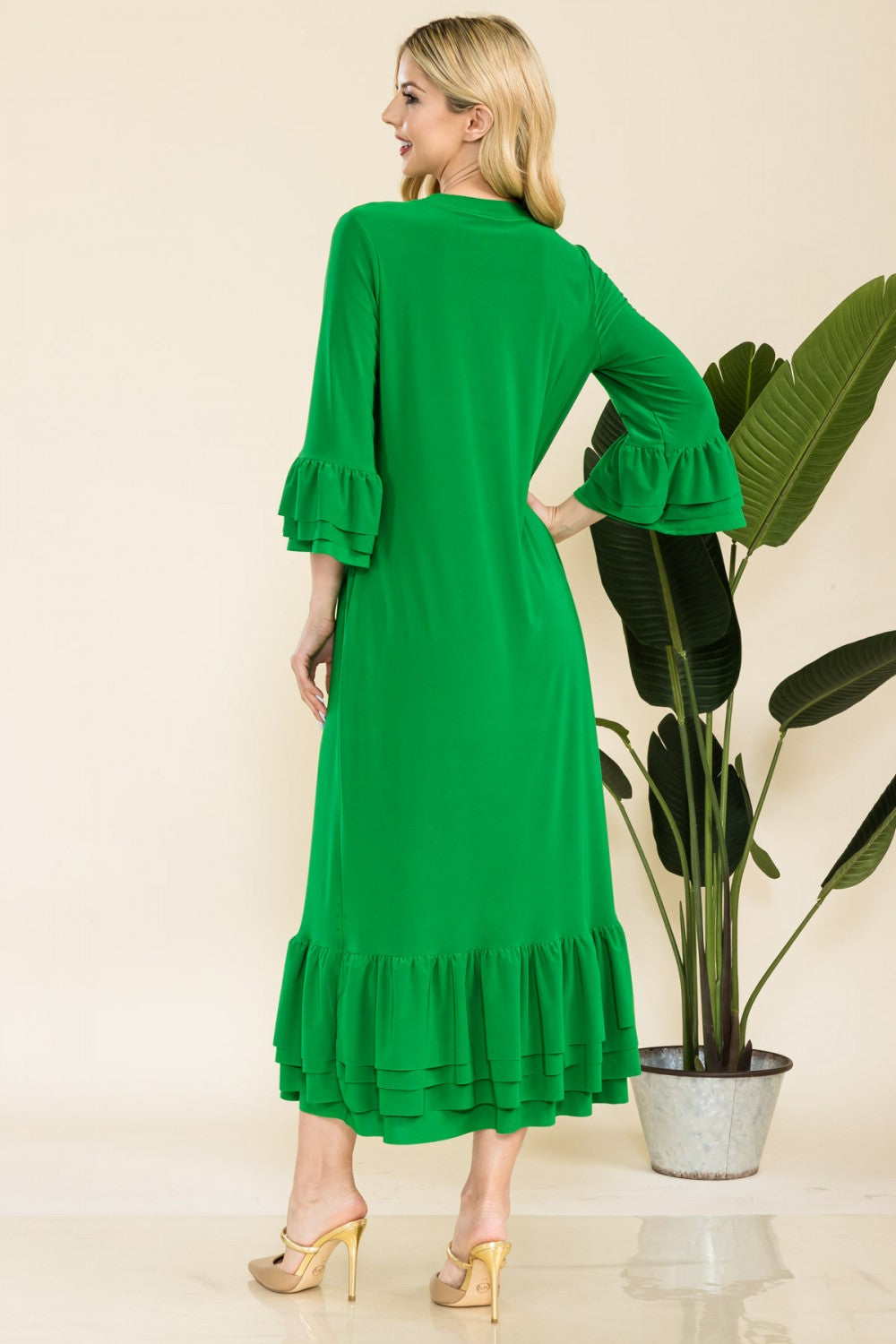 Pink modest 3/4 sleeve dress with ruffle bell sleeves from Celeste Clothing, featuring a relaxed fit and elegant design.