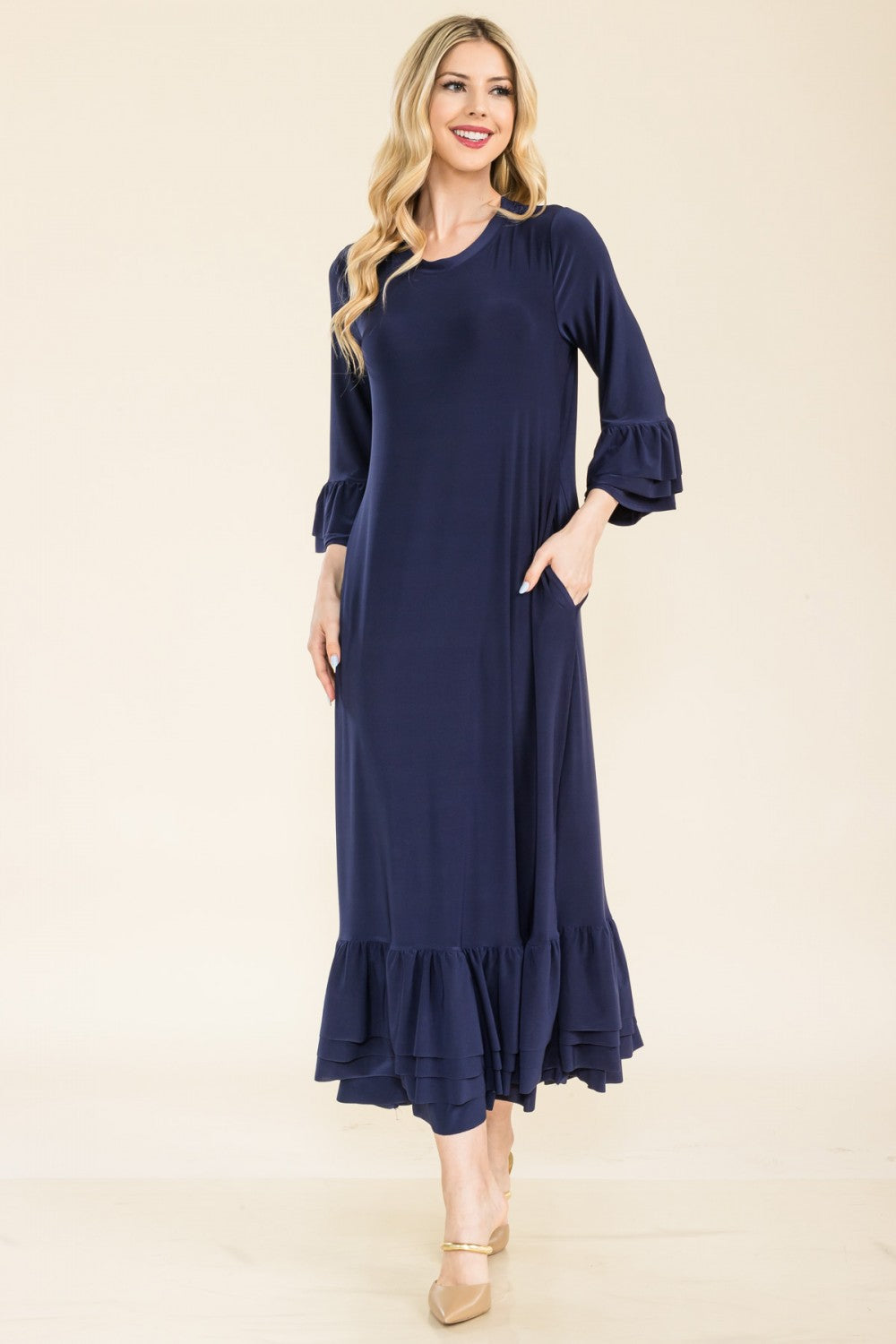 Pink modest 3/4 sleeve dress with ruffle bell sleeves from Celeste Clothing, featuring a comfortable fit and elegant design.