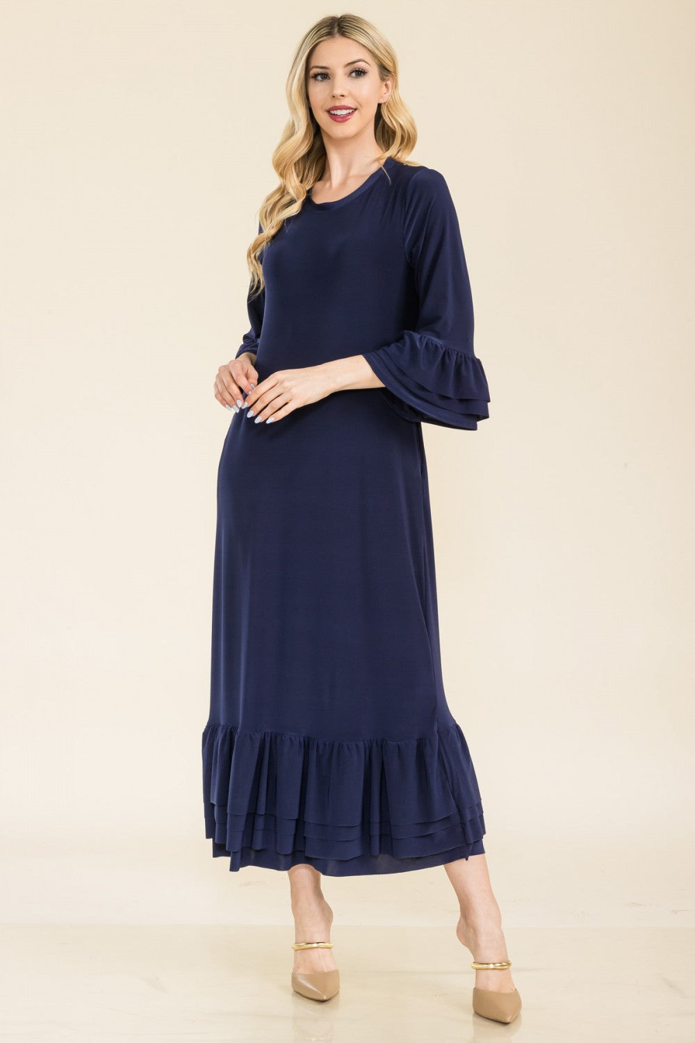Pink modest 3/4 sleeve dress with ruffle bell sleeves from Celeste Clothing, styled with a relaxed fit for regular Missy size.
