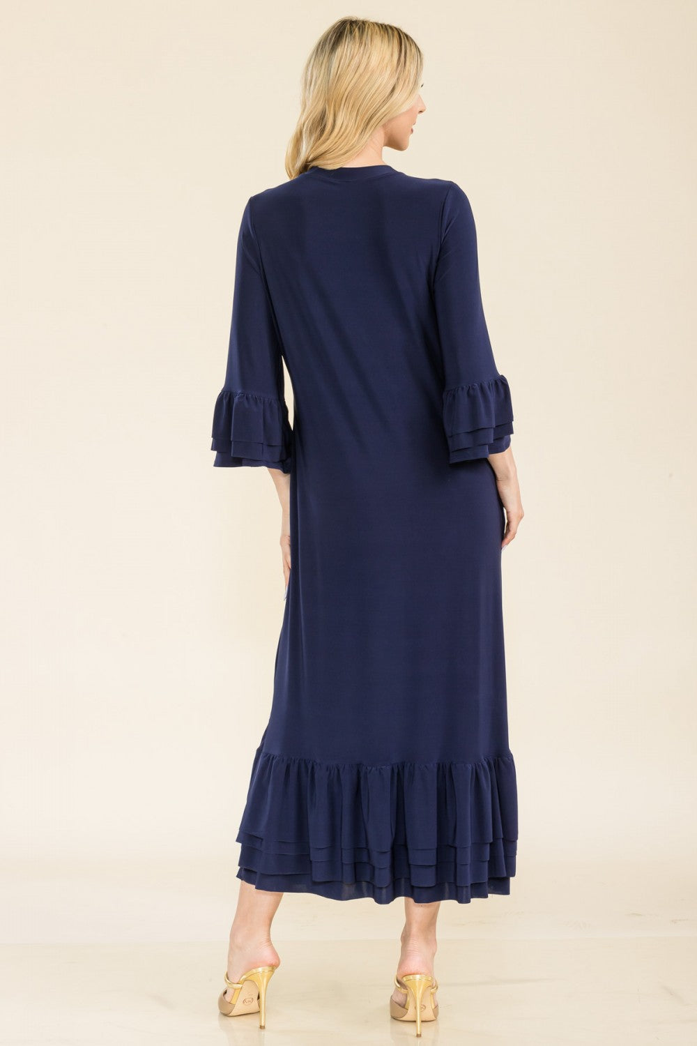 Pink modest 3/4 sleeve dress with ruffle bell sleeves from Celeste Clothing, featuring a relaxed fit and elegant design.