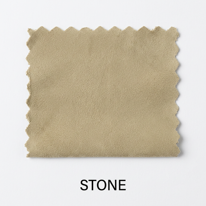 A square fabric swatch in a warm beige stone color with scalloped edges, shown on a light gray background with the word 'STONE' below it.