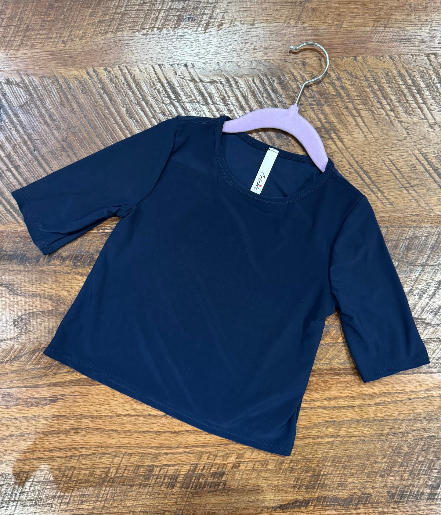 Girl's black 3/4 sleeve layering top by Celeste Clothing, featuring a soft, luxurious fabric for comfortable style.