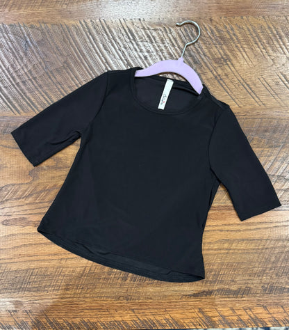 Girl's black 3/4 sleeve layering top by Celeste Clothing, soft fabric with a comfortable fit, perfect for layering in casual outfits.