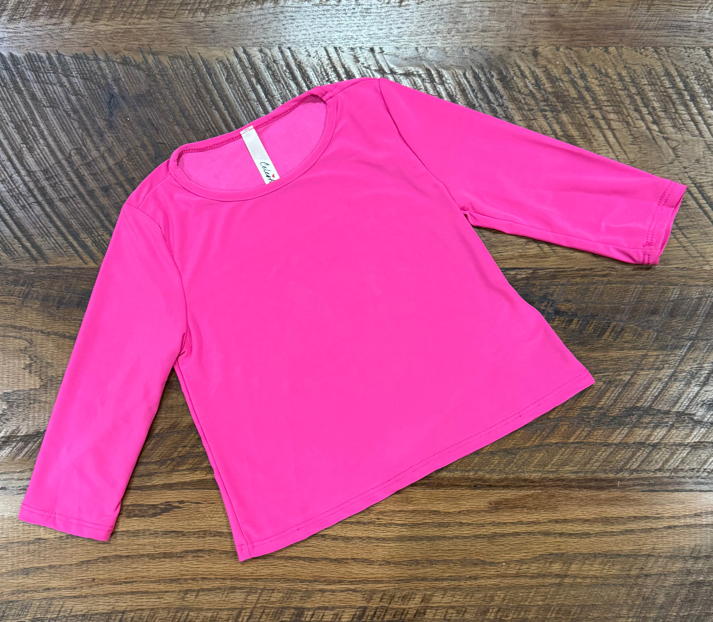 Girl's black long sleeve layering top by Celeste Clothing, soft and comfortable for layering or casual wear.