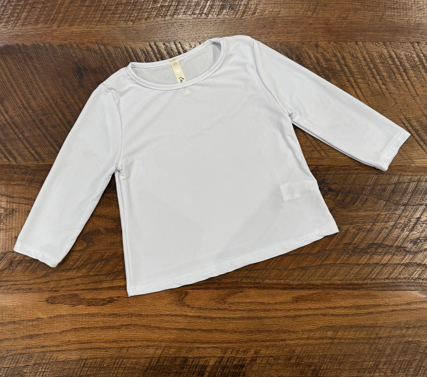 Girl's long sleeve black layering top by Celeste Clothing, featuring soft fabric and comfortable fit for casual wear.