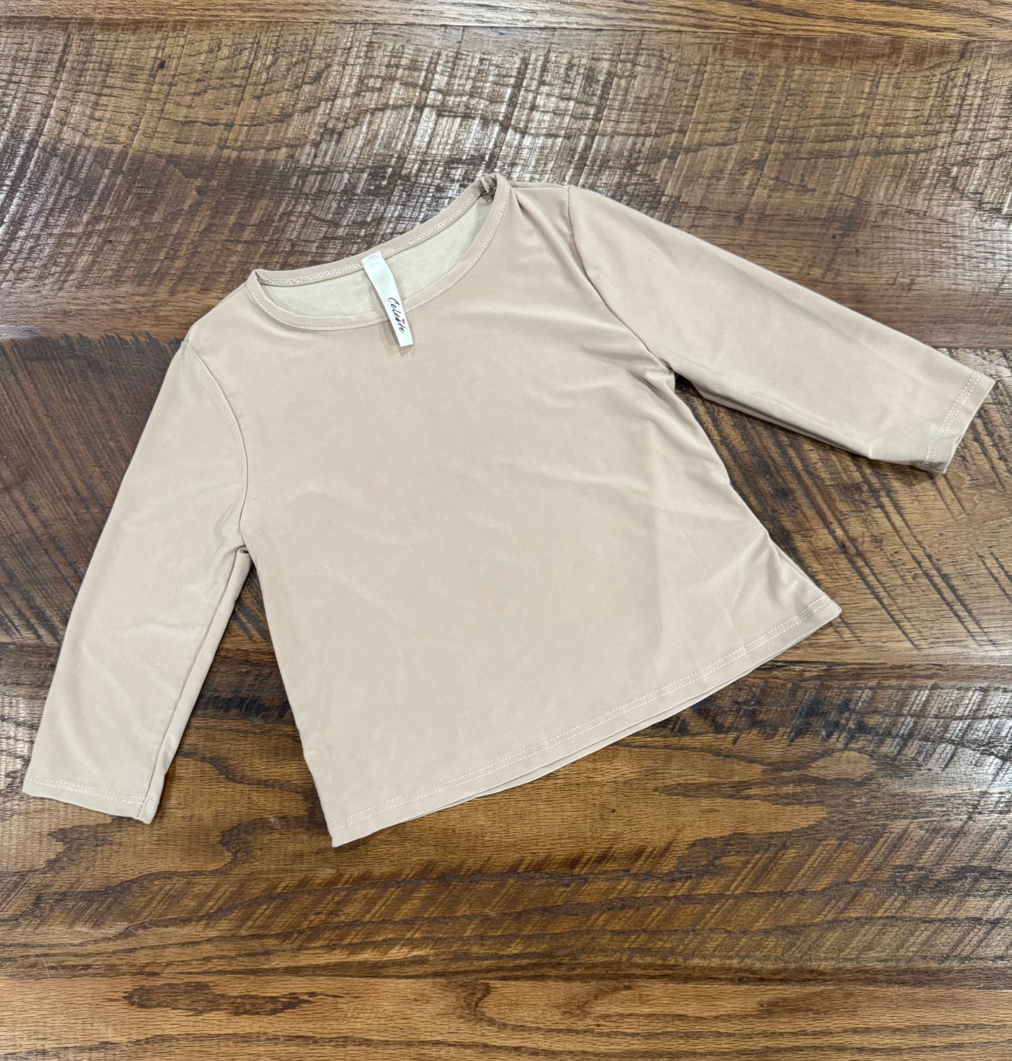 Girl's black long sleeve layering top by Celeste Clothing, soft fabric, fitted style, perfect for cozy winter outfits.