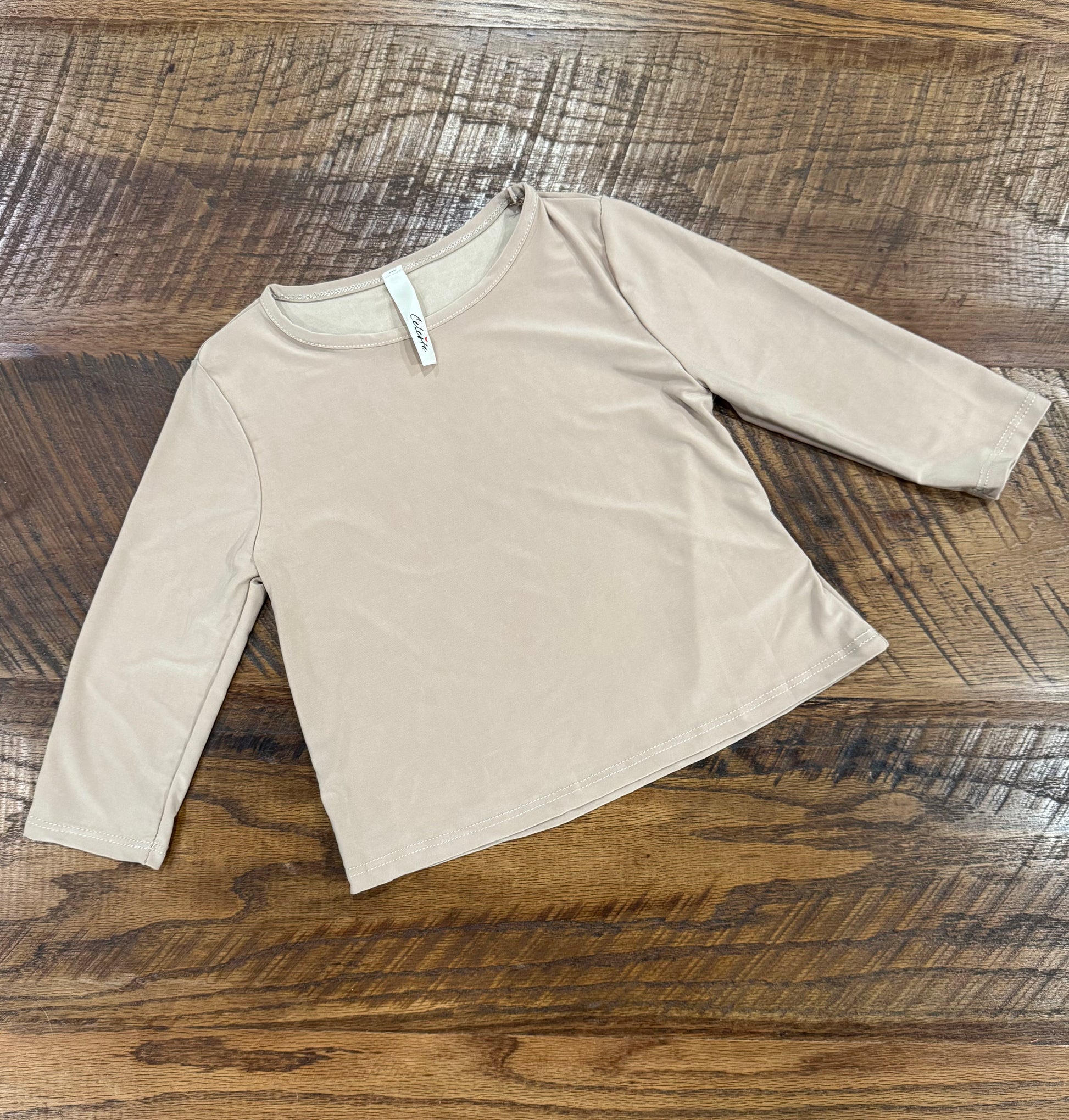 Girl's black long sleeve layering top by Celeste Clothing, soft fabric, fitted style, perfect for cozy winter outfits.