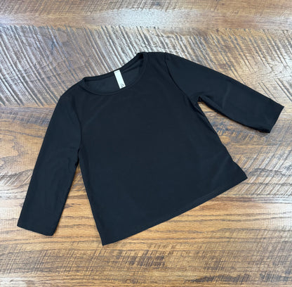 Girl's black long sleeve layering top by Celeste Clothing, soft fabric with a comfortable fit for stylish layering.