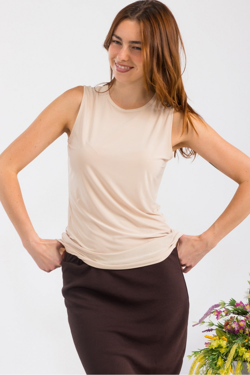Celeste Clothing white sleeveless layering top, wrinkle-free, modest design, perfect for versatile outfits, shown on a small size mannequin.