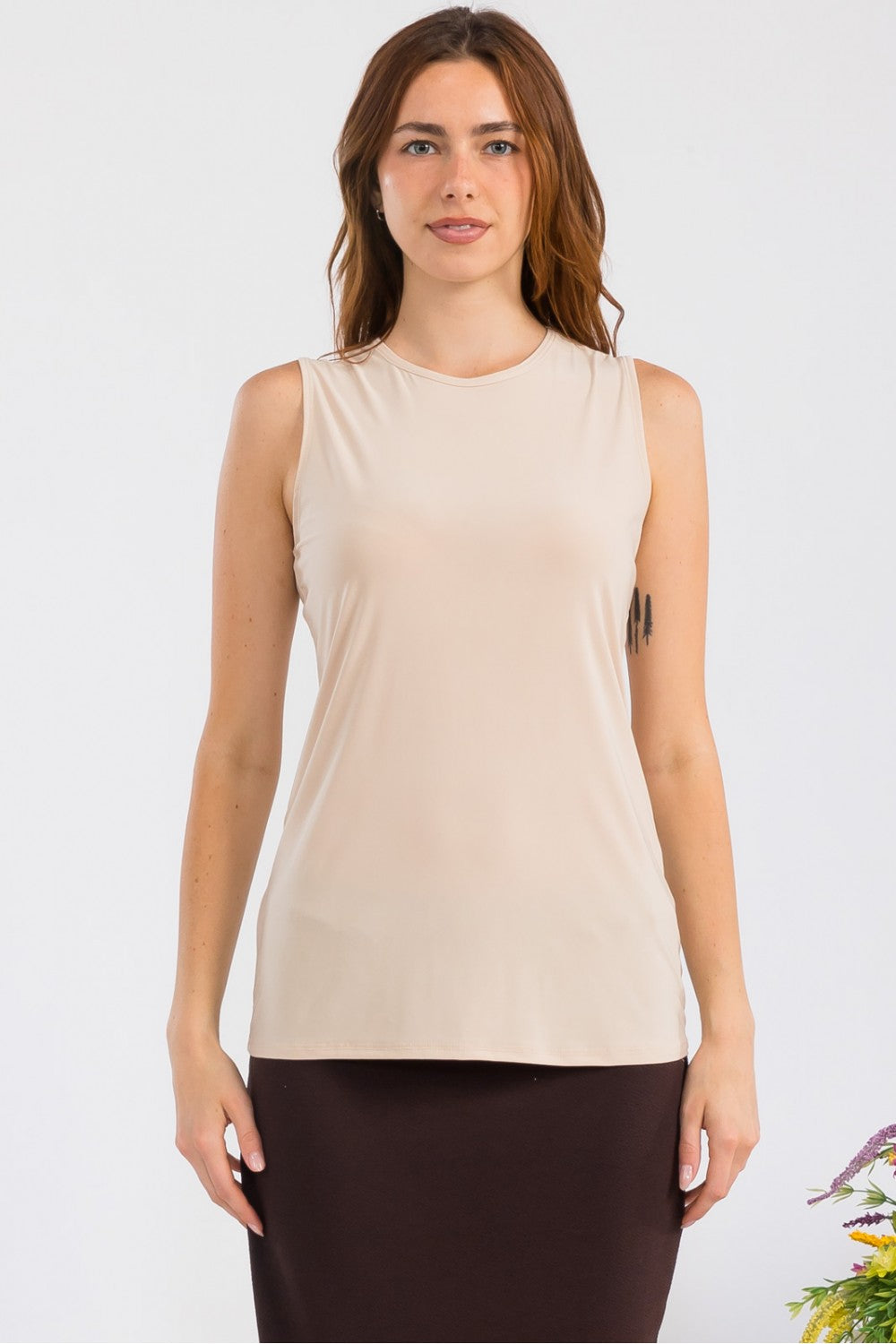 White sleeveless layering top by Celeste Clothing, wrinkle-free and modest, ideal for versatile wardrobe styling.