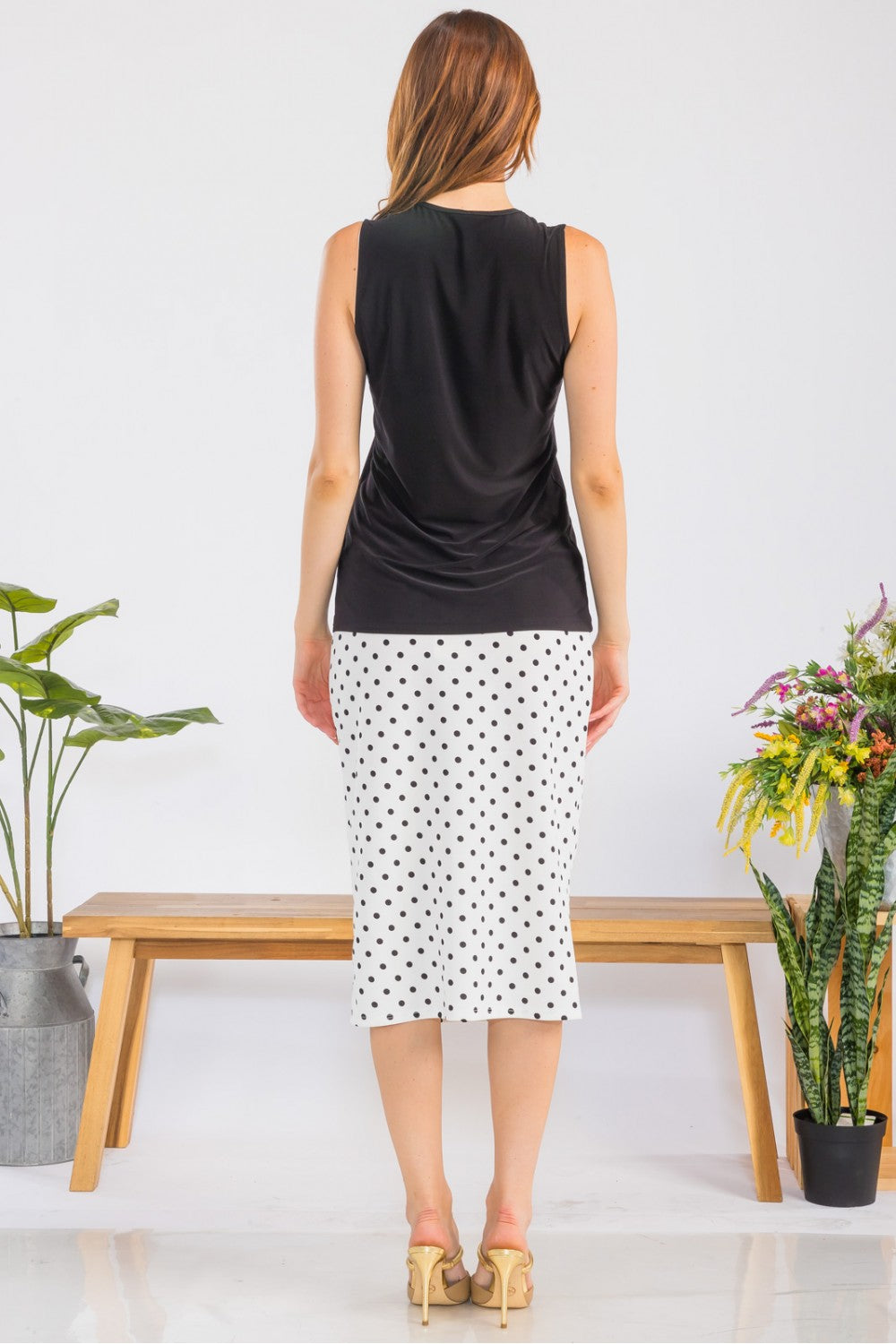 White sleeveless layering top by Celeste Clothing, wrinkle-free and modest, ideal for versatile casual or professional wear.