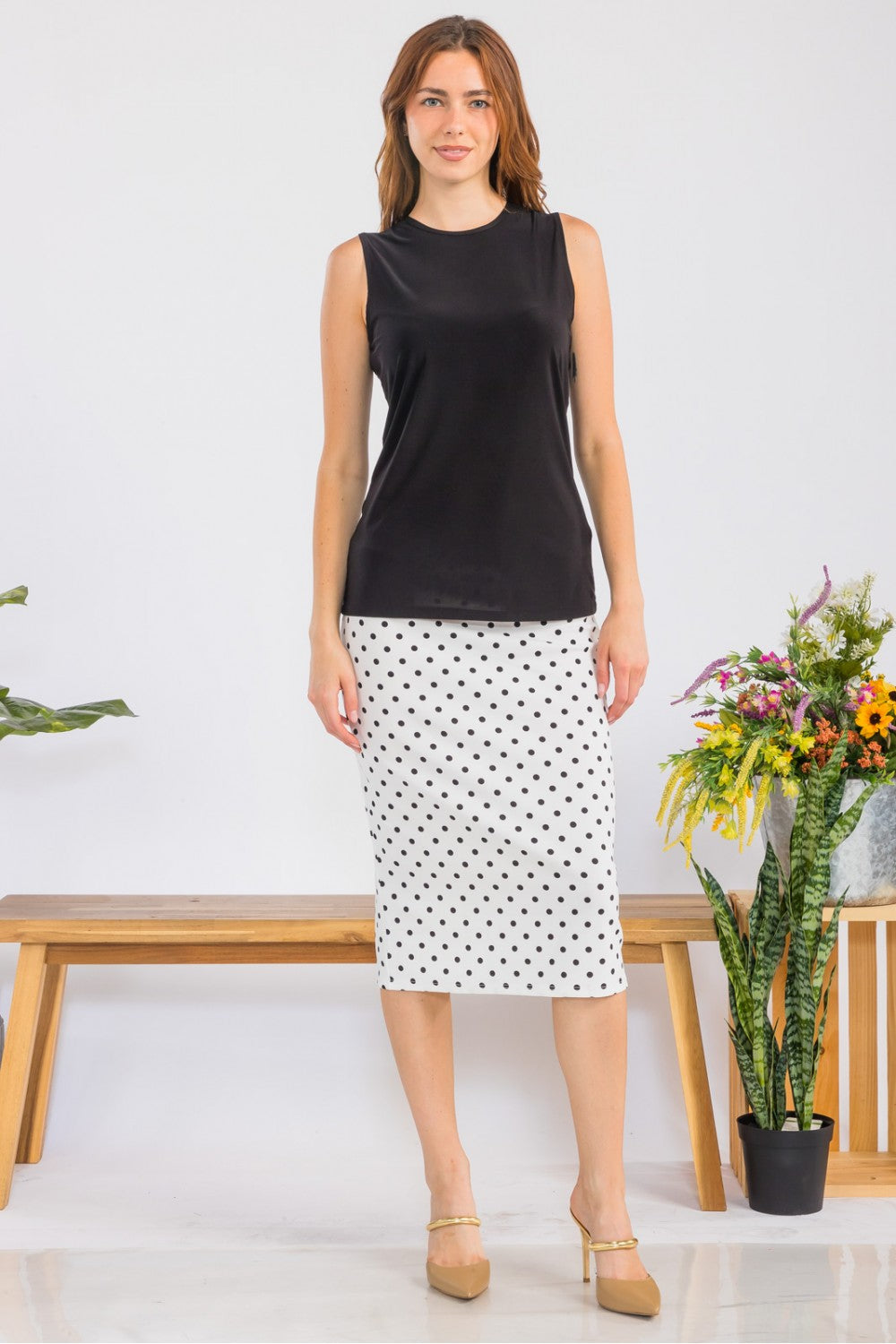 White modest sleeveless layering top by Celeste Clothing, wrinkle-free fabric, perfect for casual or office wear.
