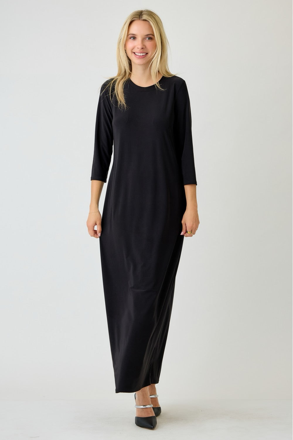 Plus size ladies' long sleeve black layering maxi dress by Celeste Clothing, showcasing a flowing, elegant floor-length design.