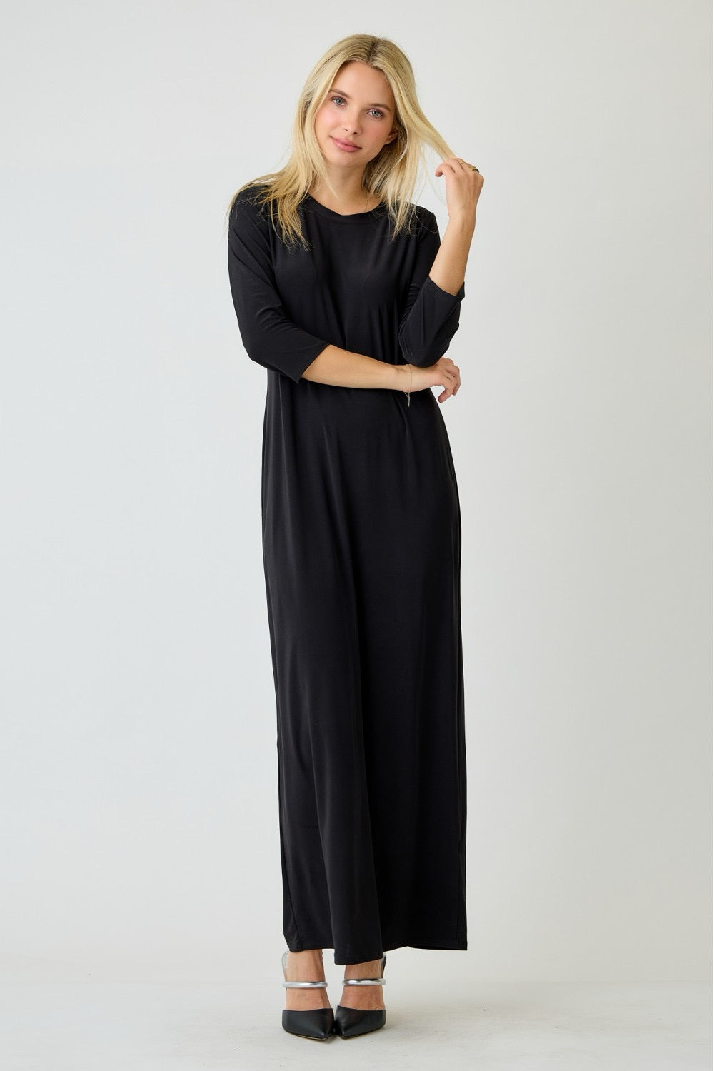 Ladies long sleeve plus layering maxi dress in classic black by Celeste Clothing, shown on a model.