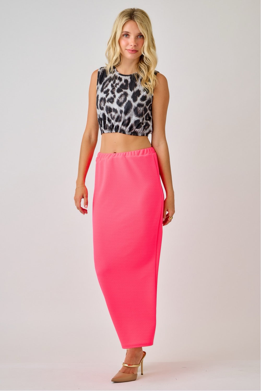 Celeste Clothing ladies maxi length pencil skirt in vibrant neon fuchsia, fitted and stylish for a sleek look.