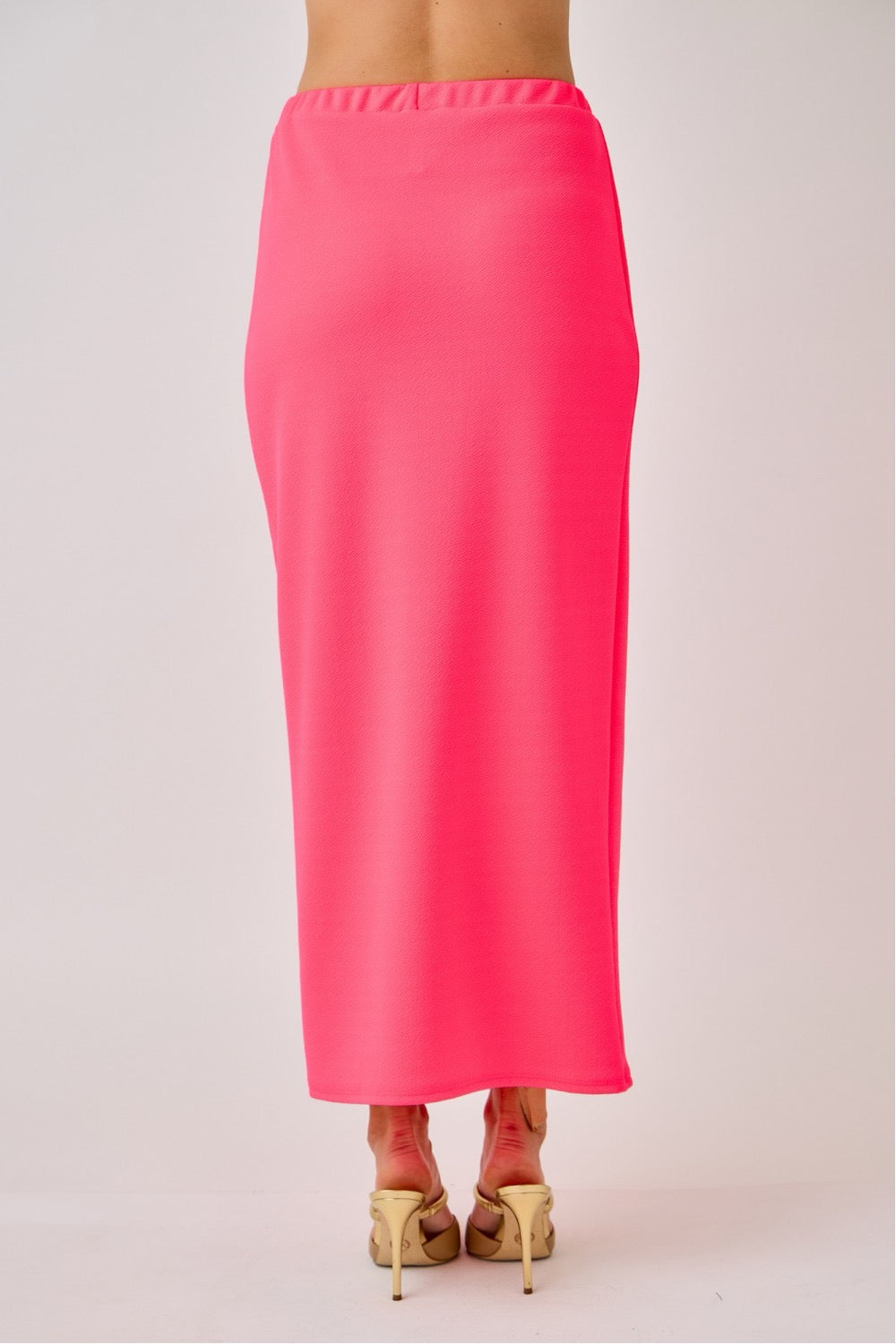 Celeste Clothing neon fuchsia ladies maxi length pencil skirt, fitted style with a sleek silhouette and vibrant color.