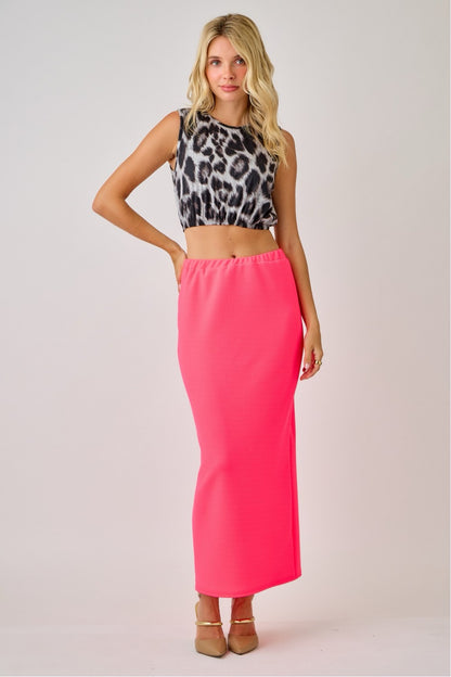 Celeste Clothing ladies maxi length pencil skirt in vibrant neon fuchsia, knee-length, fitted style for a sleek silhouette.