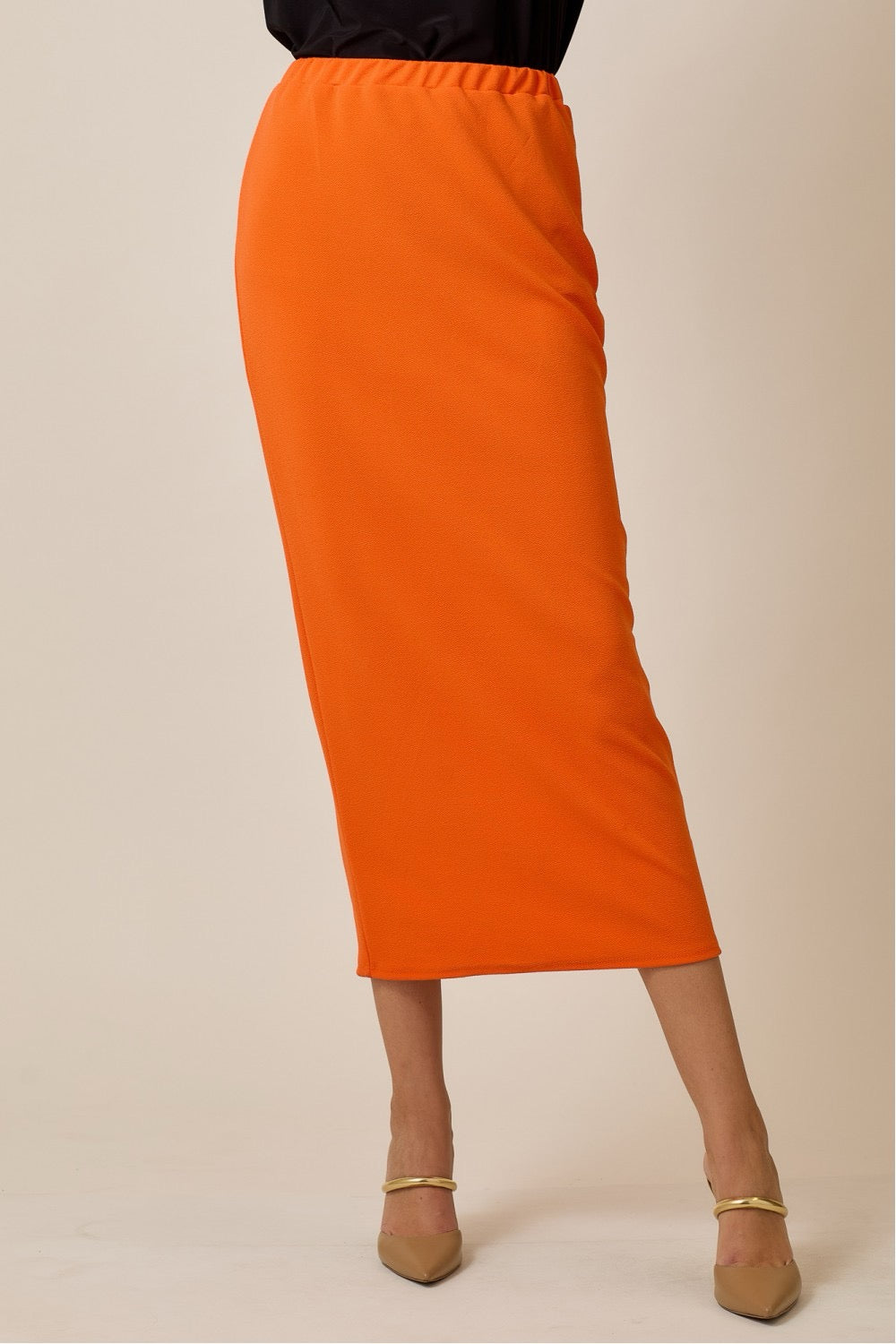 Orange ladies maxi length pencil skirt by Celeste Clothing, featuring a sleek and fitted design perfect for casual or formal wear.