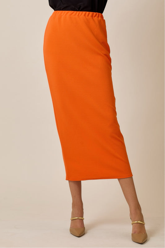 Orange ladies maxi length pencil skirt by Celeste Clothing, featuring a sleek and fitted design perfect for casual or formal wear.