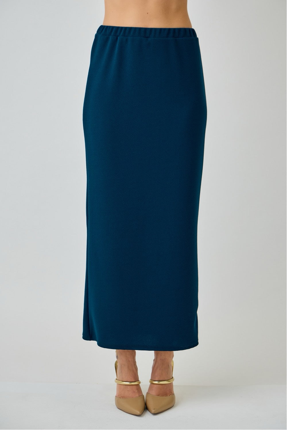 Teal ladies maxi length pencil skirt by Celeste Clothing, showcasing a fitted style and smooth fabric.