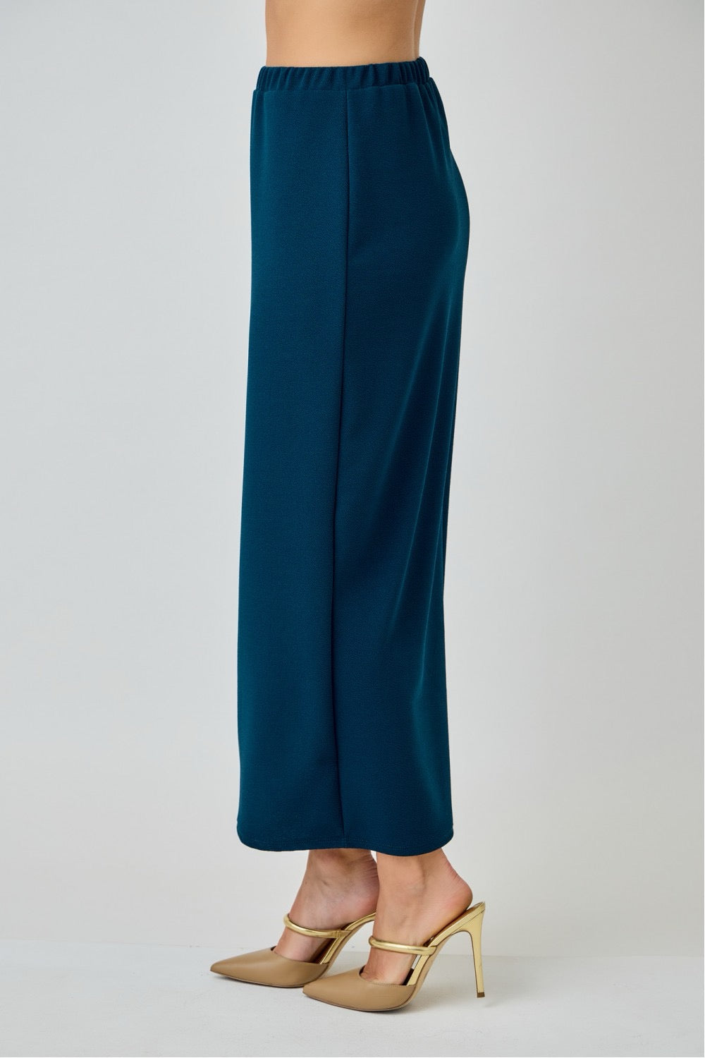 Teal ladies maxi length pencil skirt by Celeste Clothing, showcasing fitted silhouette and smooth fabric.