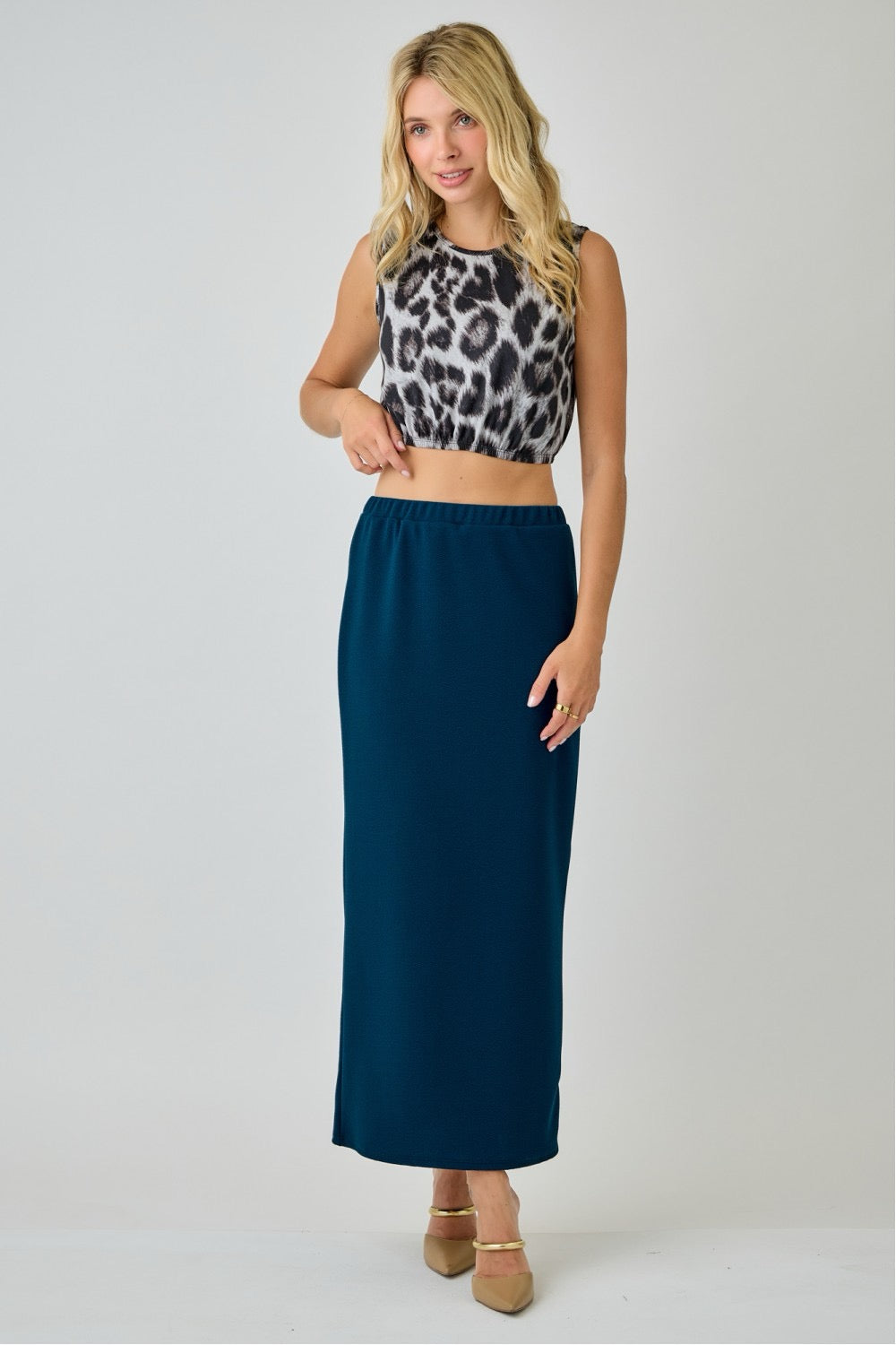 Teal ladies maxi length pencil skirt from Celeste Clothing, featuring a fitted silhouette and elegant design.