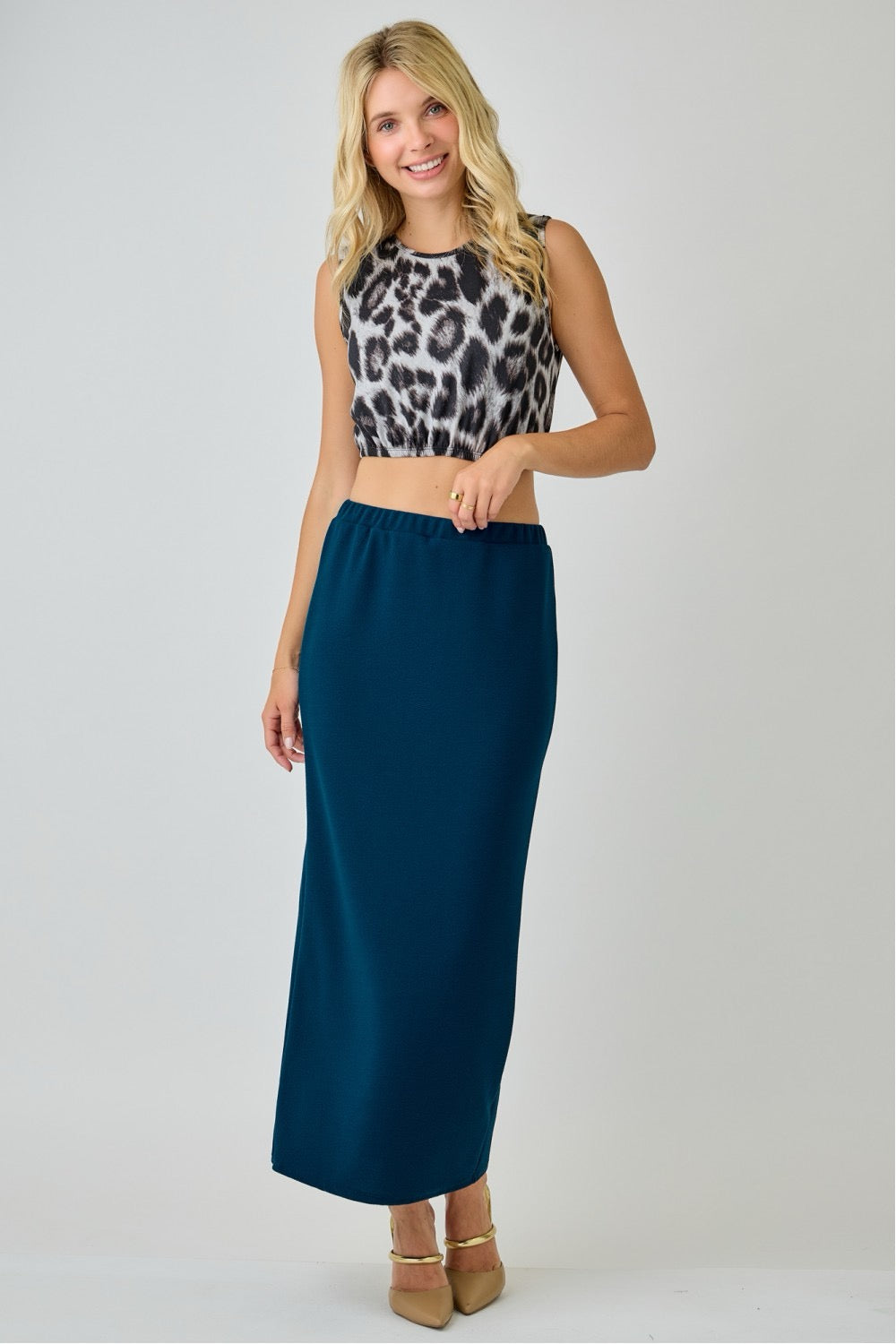 Teal ladies maxi length pencil skirt by Celeste Clothing, shown on a model, featuring a fitted silhouette and elegant style.
