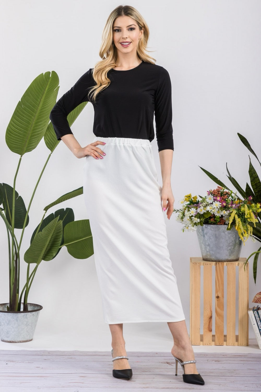 White ladies maxi-length pencil skirt by Celeste Clothing, showcasing a sleek, fitted design with a smooth fabric finish.