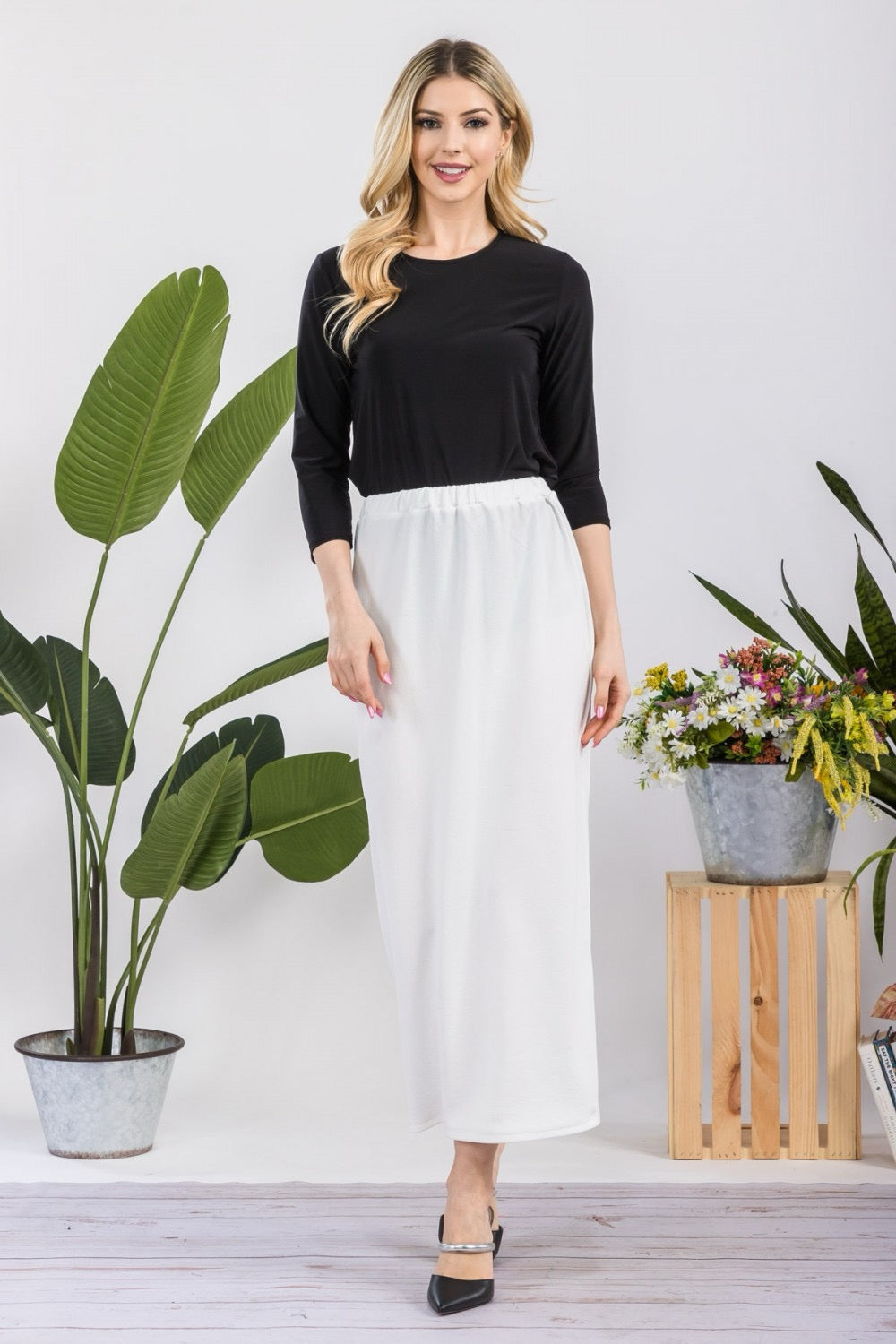 White ladies maxi length pencil skirt by Celeste Clothing, featuring a sleek, fitted design and elegant silhouette.
