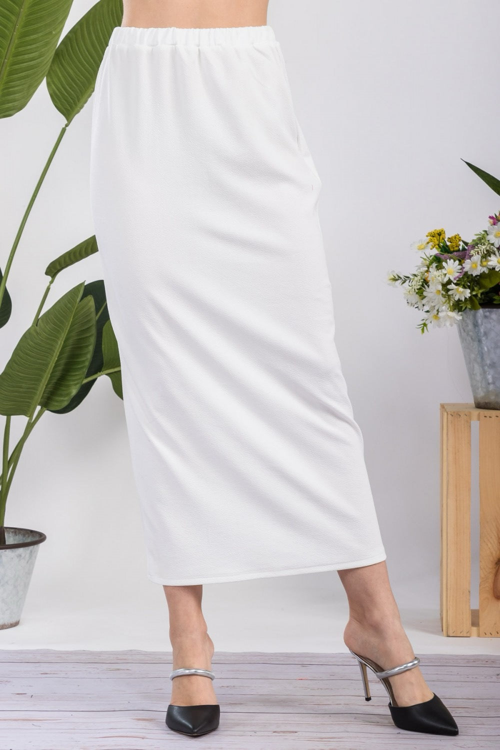 White ladies maxi-length pencil skirt by Celeste Clothing, shown in a full-length view highlighting its elegant fit and style.