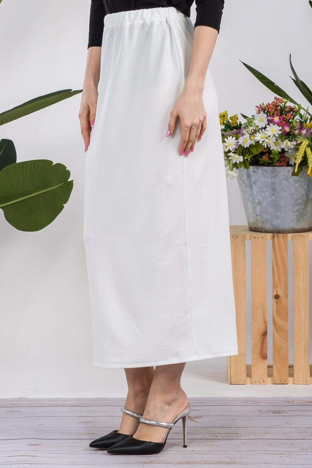 White ladies maxi length pencil skirt by Celeste Clothing, featuring a fitted design and elegant style.