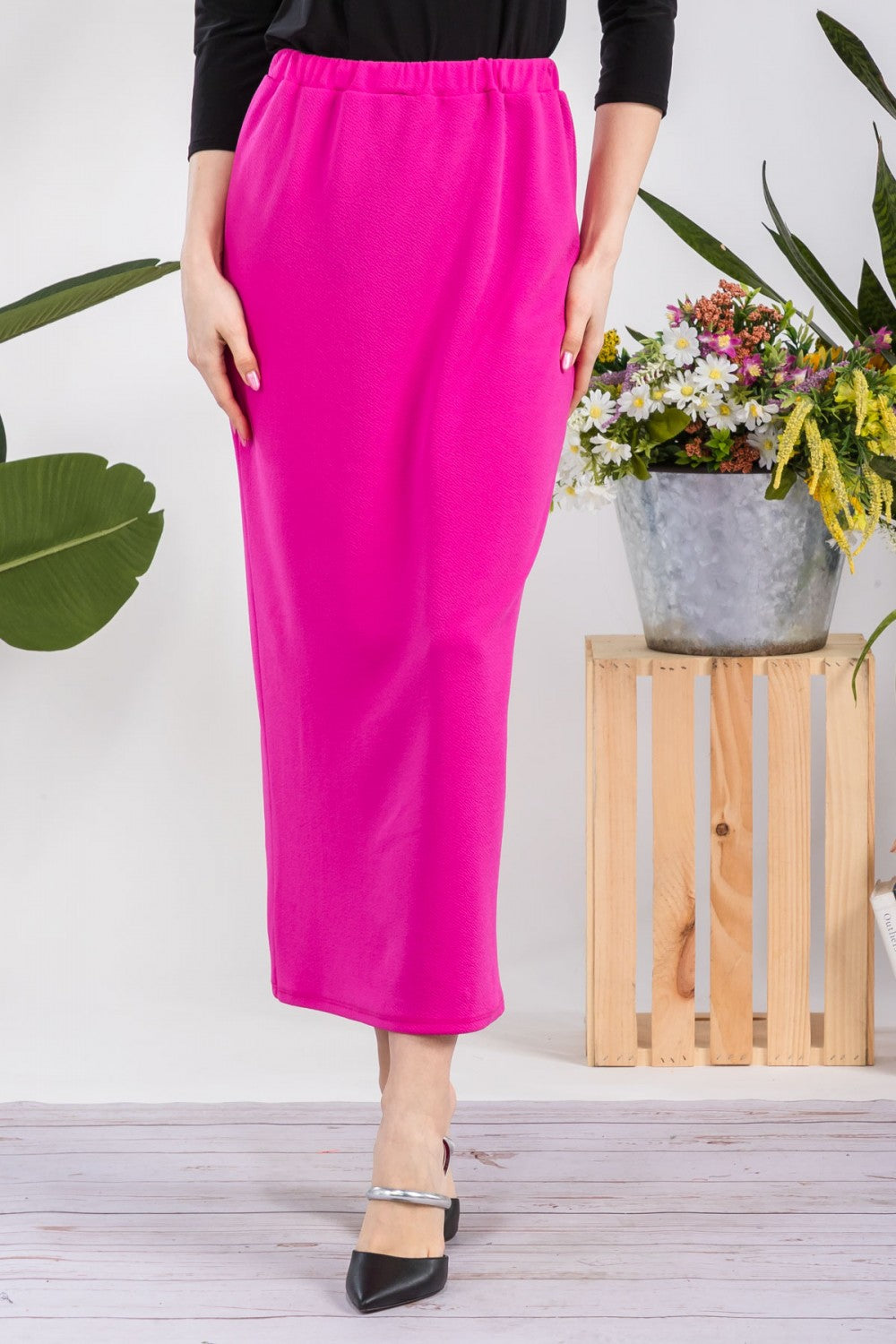 Pink ladies maxi-length pencil skirt by Celeste Clothing, shown in a close-up of the fitted, elegant design.