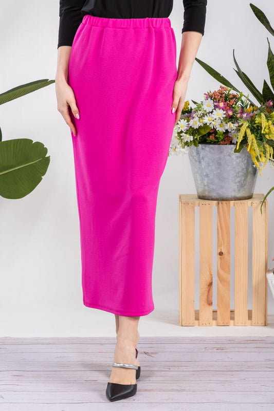 Pink ladies maxi-length pencil skirt by Celeste Clothing, shown in a close-up of the fitted, elegant design.