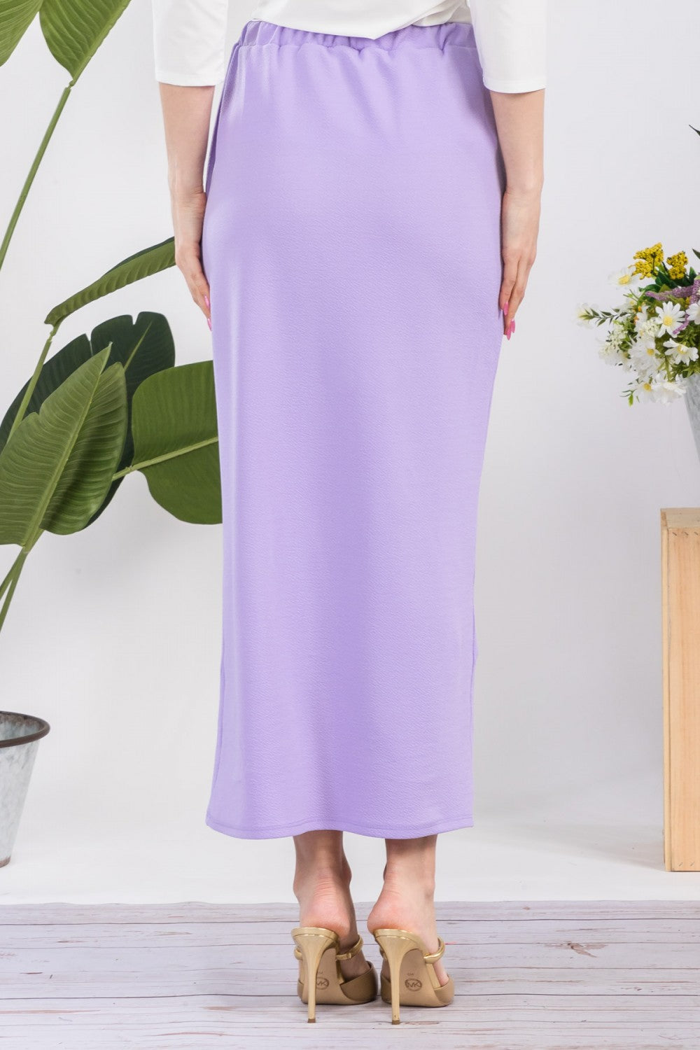 Pink ladies maxi length pencil skirt from Celeste Clothing, featuring a fitted silhouette and elegant design.