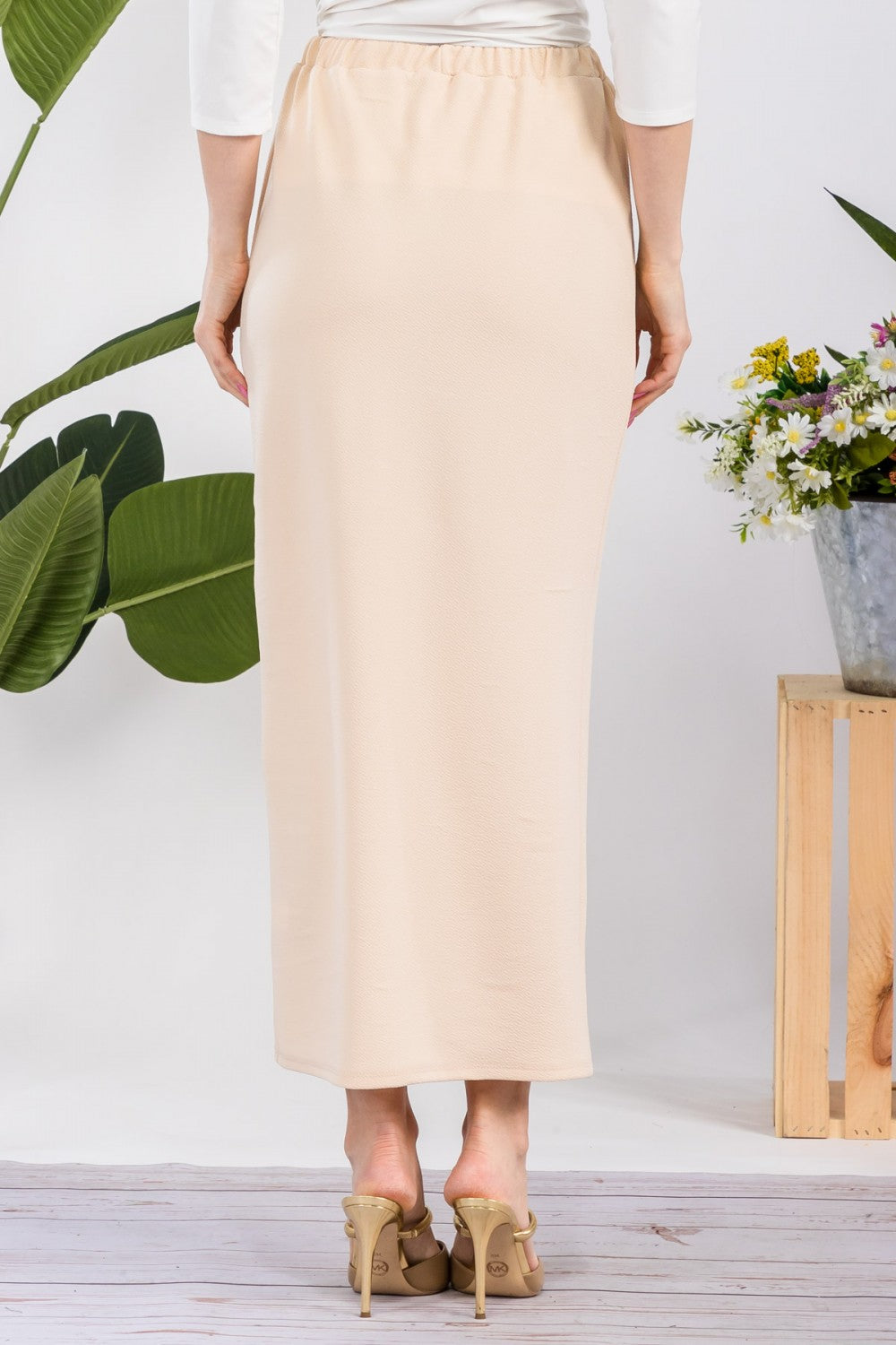 Pink ladies maxi-length pencil skirt by Celeste Clothing, showing the fitted, elegant design on a model.