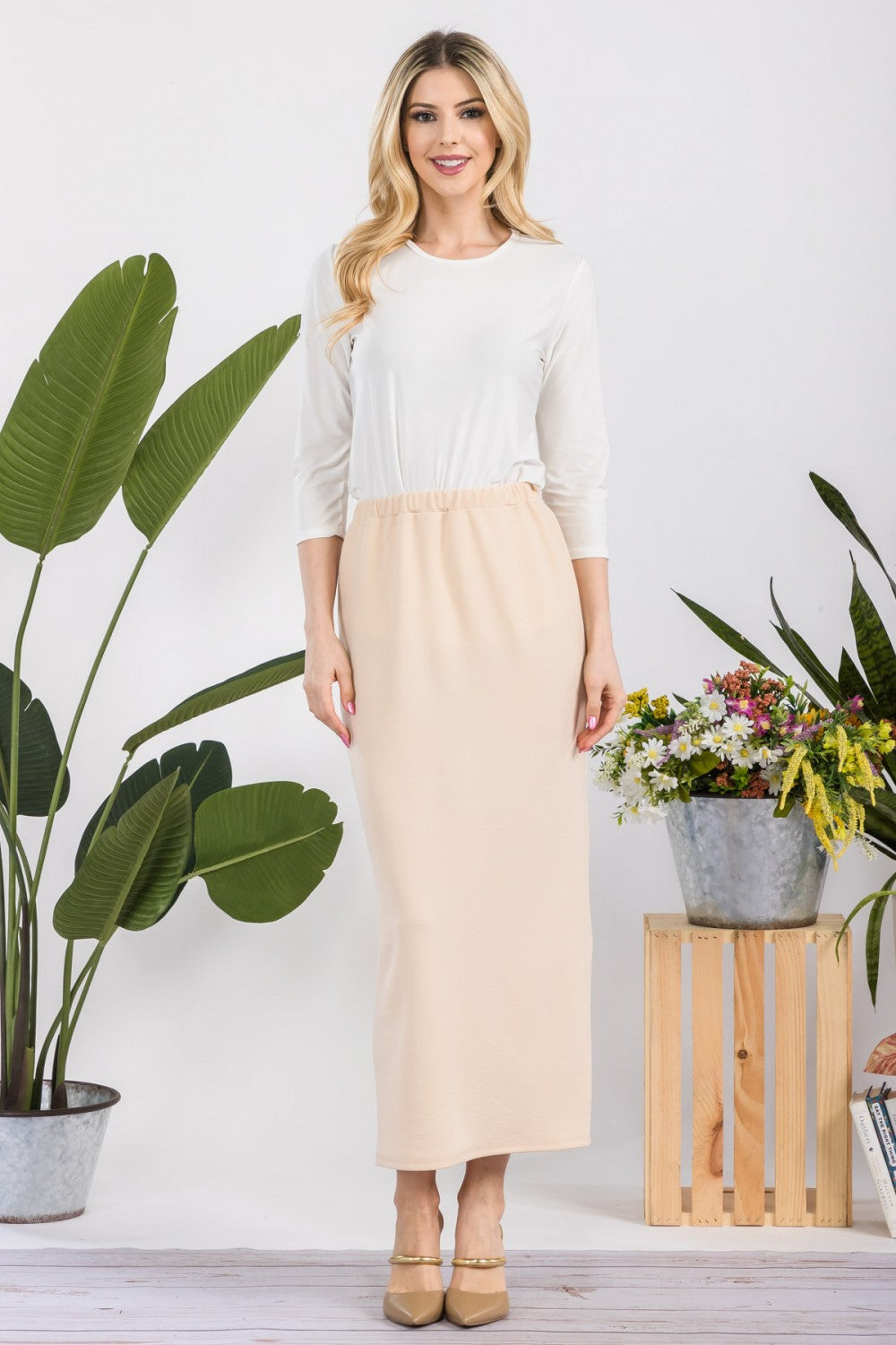 Pink ladies' maxi length pencil skirt from Celeste Clothing, featuring a sleek, fitted silhouette and elegant design.