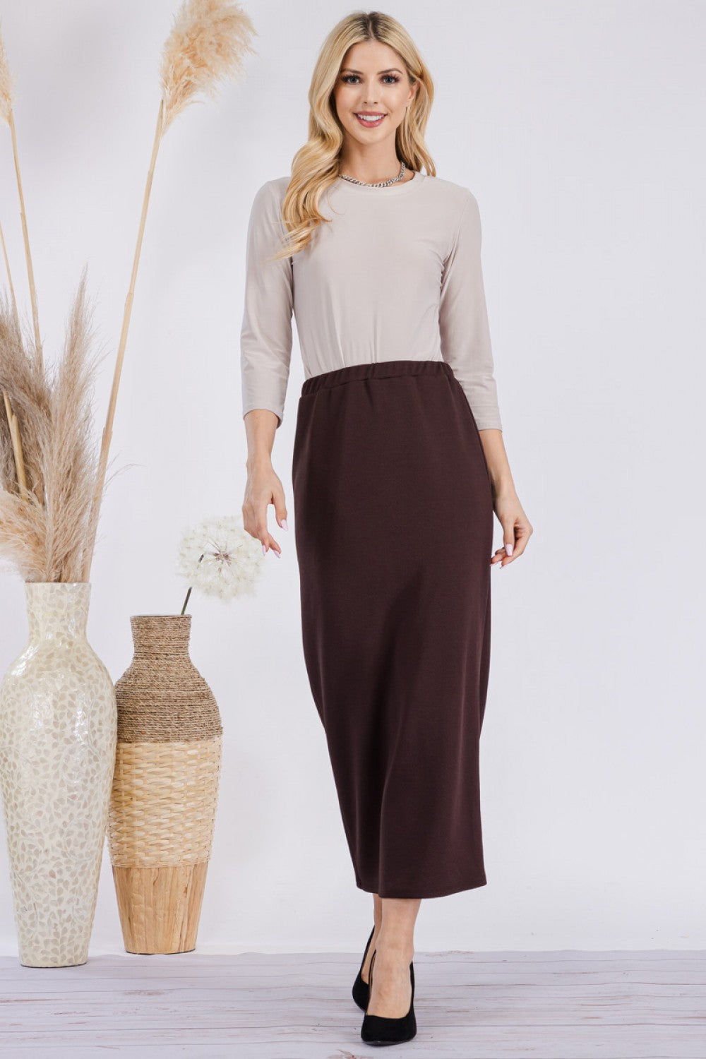 Pink ladies maxi length pencil skirt by Celeste Clothing, displayed on a model showing the fitted, elegant design.