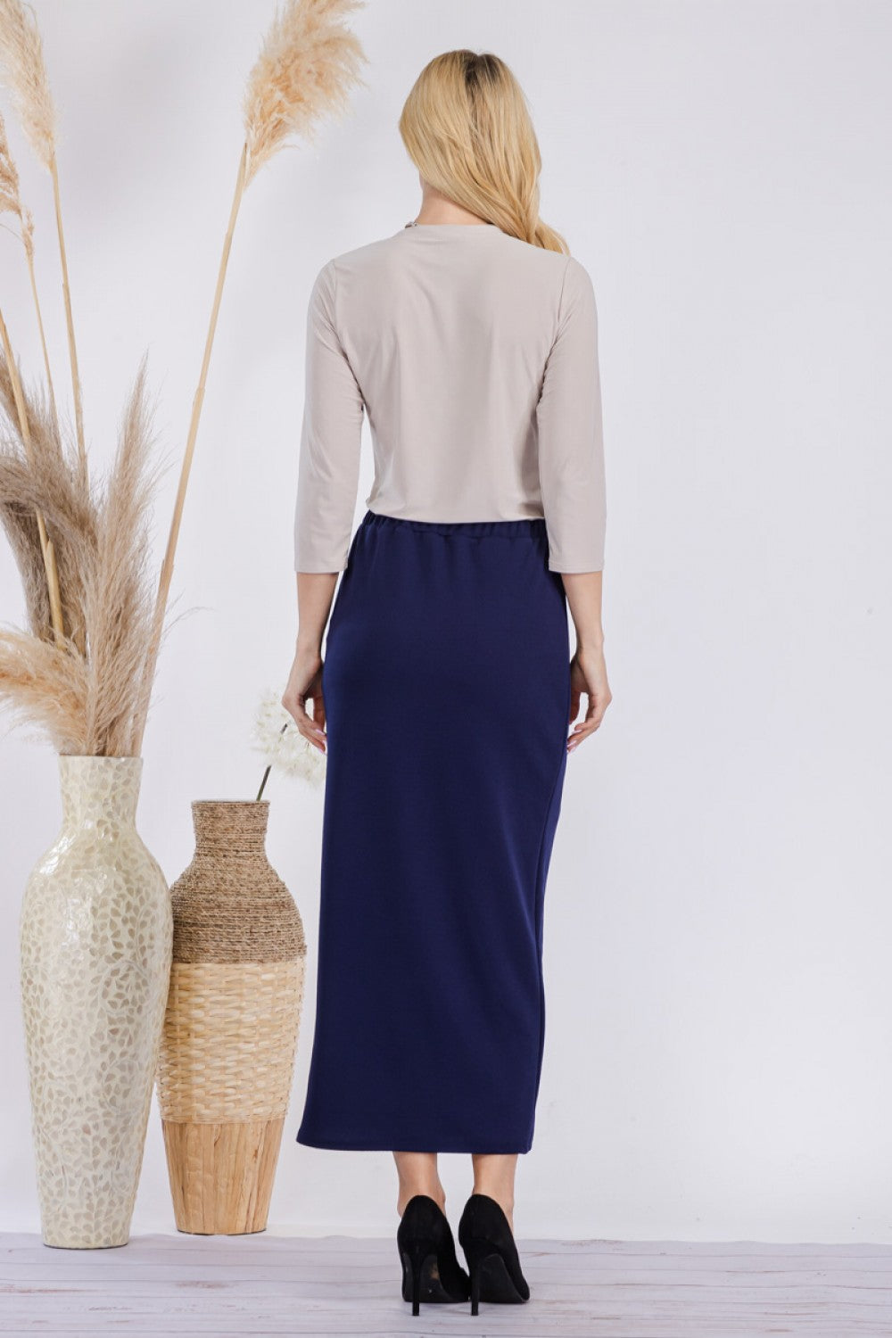 Pink ladies maxi-length pencil skirt from Celeste Clothing, styled with a fitted silhouette and elegant design.