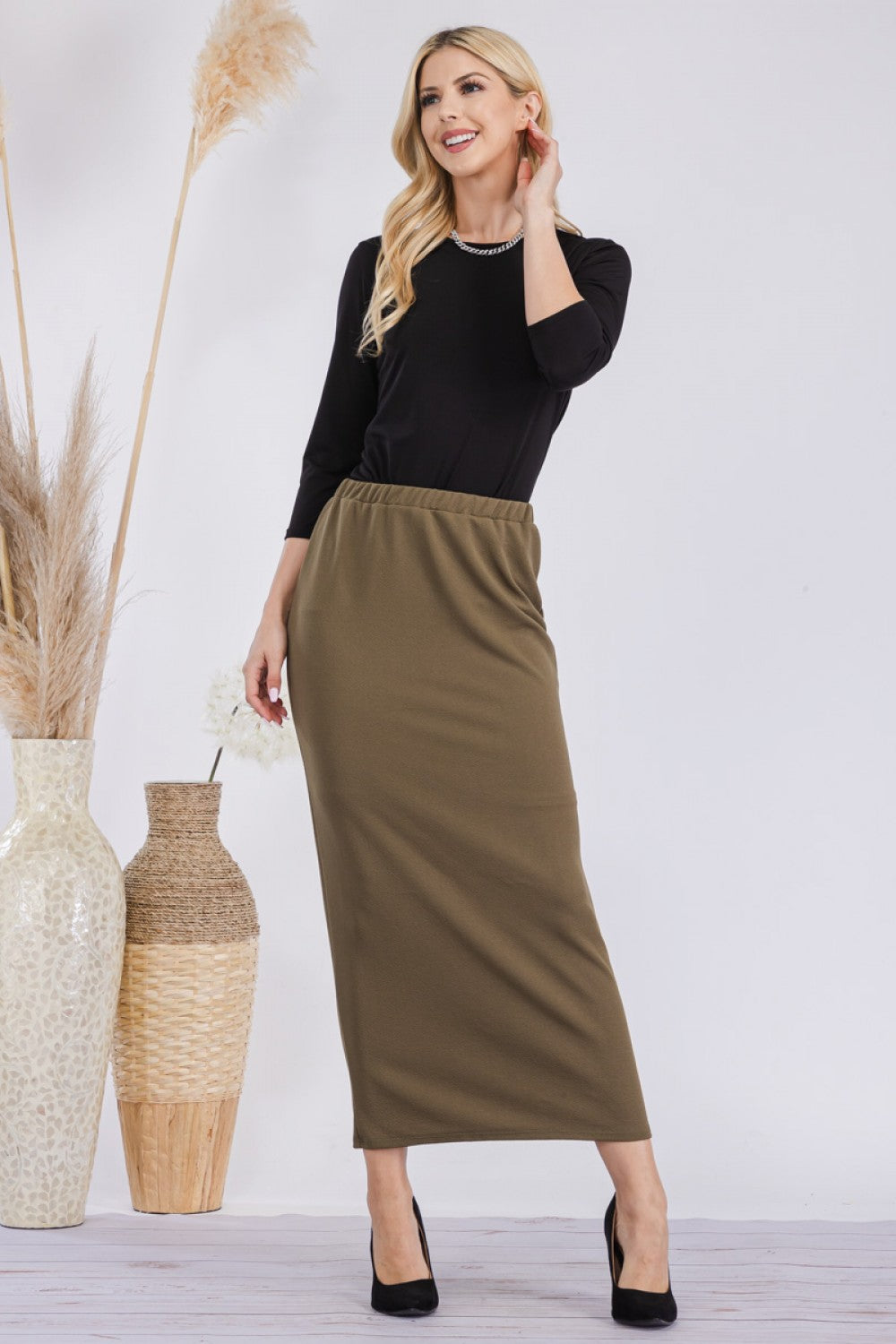 Pink ladies maxi length pencil skirt by Celeste Clothing, showcasing a fitted design and smooth fabric.