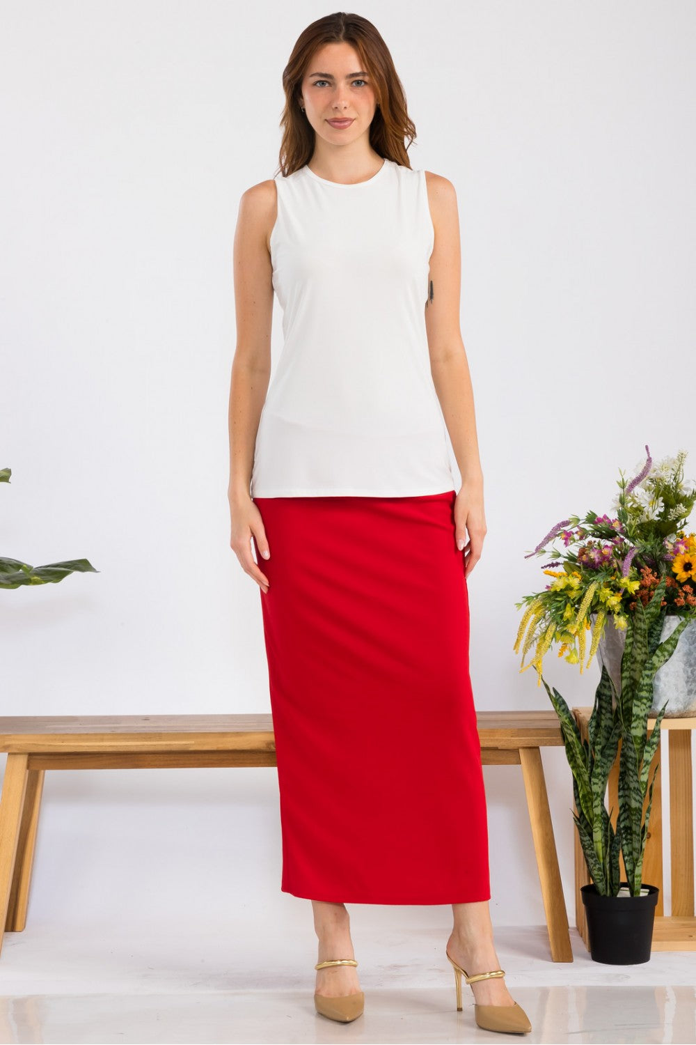 Pink ladies' maxi length pencil skirt by Celeste Clothing, showing a close-up of the fitted, elegant skirt fabric and style.