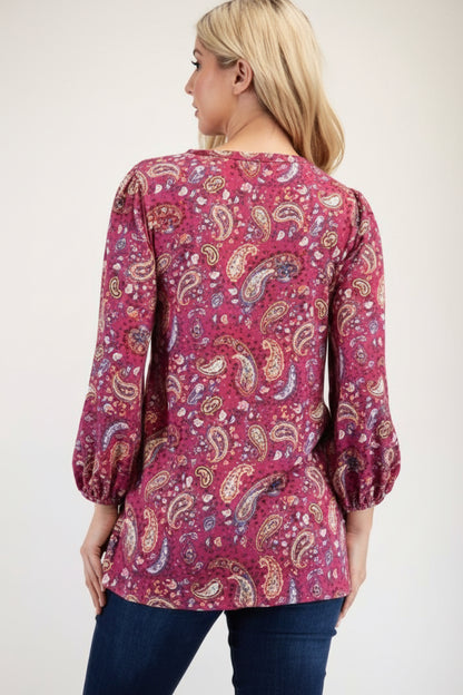 Blue paisley bishop sleeve top from Celeste Clothing, a stylish shirt with flowy bishop sleeves and intricate paisley pattern.