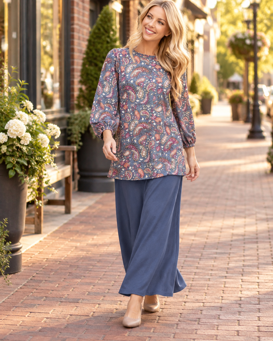 Blue paisley bishop sleeve top from Celeste Clothing, stylish blouse with flowing sleeves and intricate pattern.