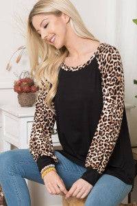 Leopard print long sleeve colorblock top by Celeste Clothing, stylish shirt with bold animal print and colorblocking details.