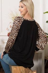 Leopard print long sleeve colorblock top by Celeste Clothing, stylish women’s shirt with bold pattern and color blocking.