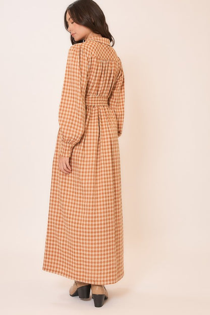 Gingham long sleeve button-down tie waist maxi dress by Cozy Co, featuring a classic pattern and flowing silhouette.