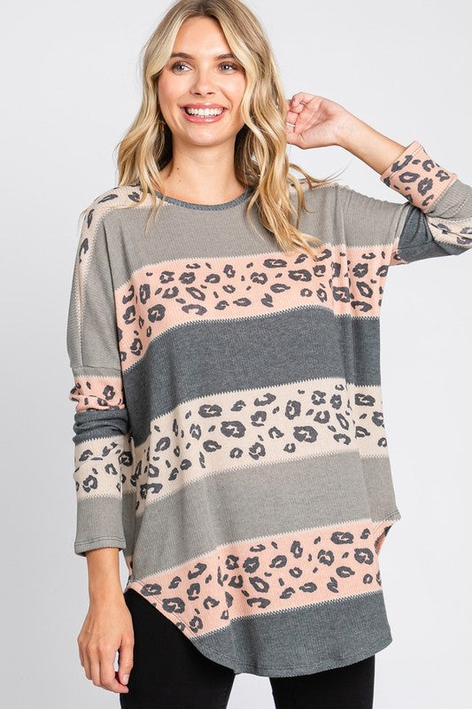 Women's multi-color leopard print long sleeve tunic top with round hem by Cream N Sugar, stylish and comfortable for casual wear.